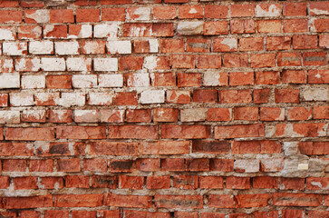 Abstract background of time damaged brick wall.