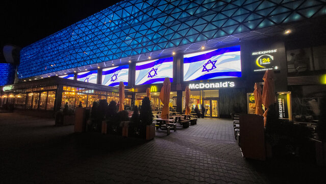 Illumination in the form of flags in support of Israel against the war with Palestine, lit on a shopping center near a restaurant McDonalds in Kyiv, Ukraine, october 2023