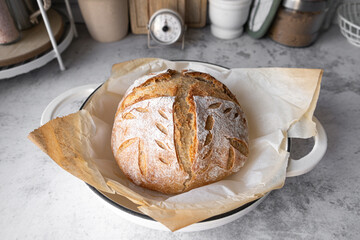 The sourdough bread or artisan bread in the Dutch oven pan. Healthy breakfast bread. Natural yeast fermentation for bakery and baking pastry. - Powered by Adobe