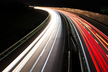 Fototapeta na wymiar Traffic in motion blur. Traffic on highway at night.