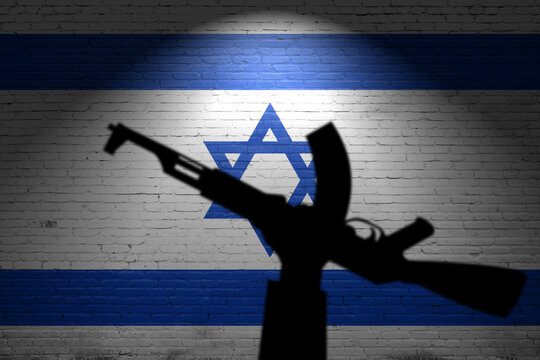 Flags of Israel painted on the brick wall. Terrorist organizations hezbollah and hamas
