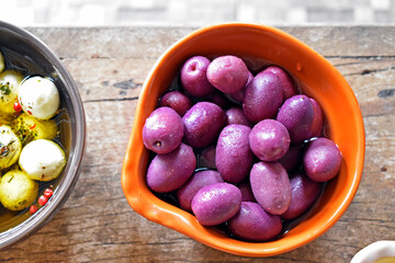 Bowl with purple olives on the table