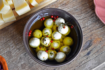 Bowl with goat cheese on the table