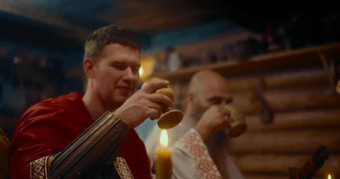 dwellers of medieval village of slavic settlement, portrait of three men drinking alcohol, 4K Prores