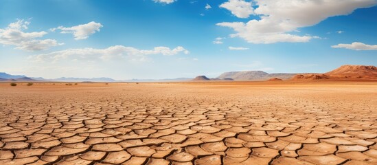 Global warming concept depicted through a dry desert panorama - obrazy, fototapety, plakaty