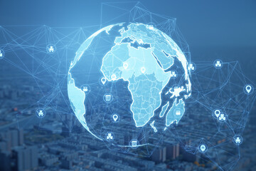 Creative glowing polygonal globe hologram with icons on blurry city texture. Global technology and internet concept. Double exposure.