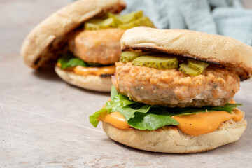 Salmon fishburger on english muffin