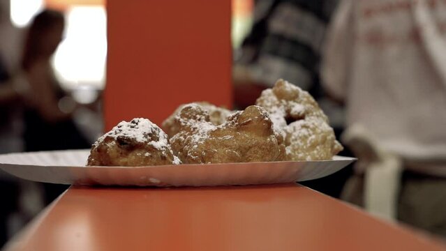 Close up Zeppole on counter Slow Motion Williamsburg Broooklyn