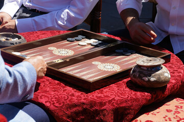 Two men playing a game of backgammon