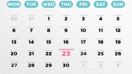 Close-up of a beautiful November page of the wall calendar 2023 and the camera moves to Thanksgiving Day date marked on it