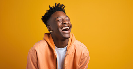 portrait of a person laughing heartily against a vibrant colored background
