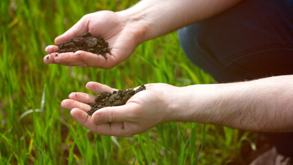 Farmer holding land in his hands