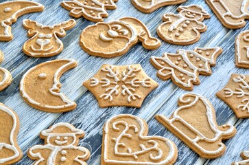 Christmas background with gingerbread. Sweet gingerbreads on a wooden table. - 659156113