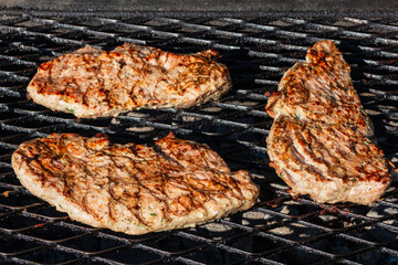 Pork steak. Juicy steaks grilled on the grill