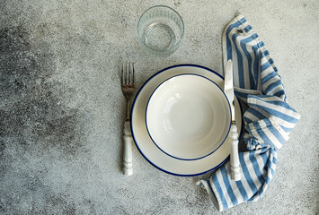 Minimalistic rustic table setting on gray surface
