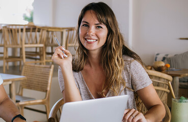 Creative millennial couple working online from tropical villa