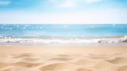Fototapeta na wymiar Seascape abstract beach background blur bokeh light of calm sea and sky Focus on sand foreground 
