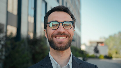 Happy business entrepreneur successful Caucasian businessman near office building outside male portrait smiling guy in spectacles outdoors joyful man CEO leader manager in city cheerful toothy smile