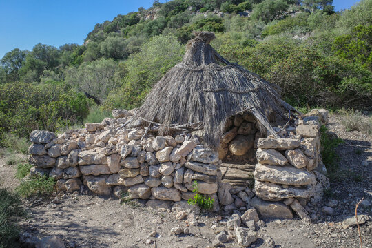 Mallorca, Spain - 8 Oct, 2023: Ancient charcoal huts at the Puig de sa Marisca archaeological site