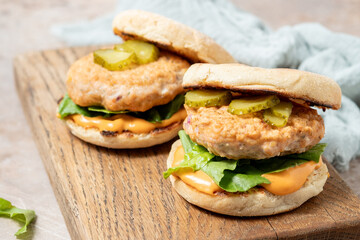 Salmon fishburger on english muffin