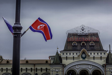 The North Korean flag and the building of Vladivostok railway station with the word "Vladivostok" (in Russian), before North Korean leader Kim Jong Un's visit to Primorsky krai, Russia in April 2019.