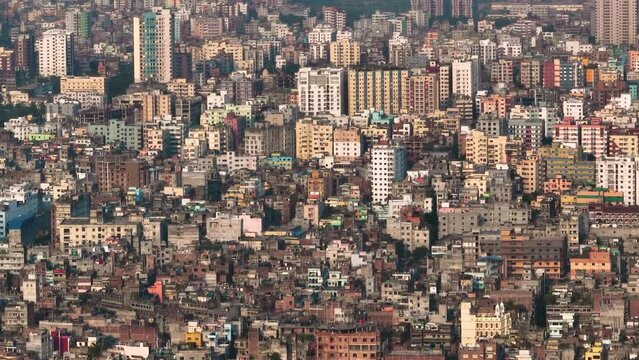 Aerial view of Dhaka city, the vibrant and bustling capital of Bangladesh. The cosmopolitan city is a blend of modern and traditional, with towering skyscrapers, bustling markets. Buriganga
