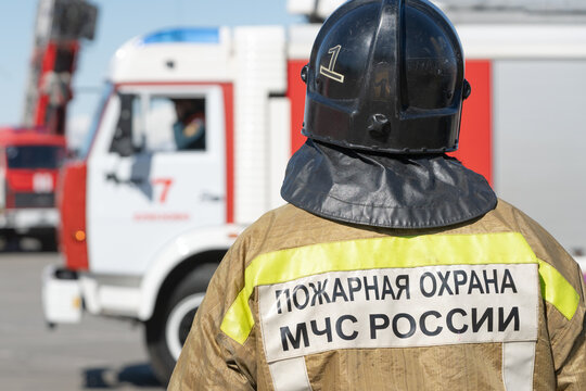 Back view of inscription Emercom of Russia on uniform firefighter of Ministry of Civil Defence, Emergencies and Disaster Relief of Russian Federation MChS. Kamchatka Peninsula, Russia - April 27, 2019