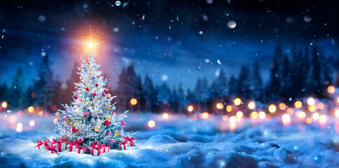 Christmas Tree And Gift Boxes On Snow In Night With Shiny Star and Forest - Winter Abstract...