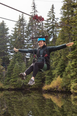 Adventure Woman riding on a Zipline.