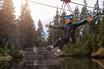 Adventure Woman riding on a Zipline.