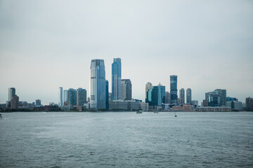 Obraz premium New York, New York state USA - August, 30, 2023 - Staten island ferry on the hudson river in lower manhattan in New York city on a sunny day, United States.