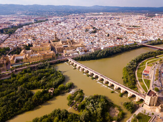 Aerial view of cityscape of Cordoba with Roman Bridge over the Guadalquivir and the Mosque-Cathedral of Cordoba
