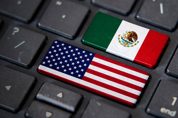 USA and Mexico flags on computer keyboard