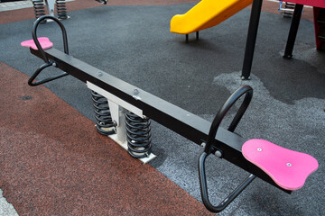 Empty seesaw on playground in public park