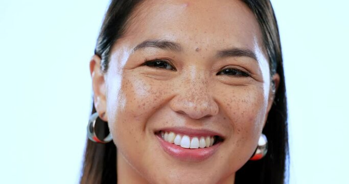 Woman, face and smile with beauty in self love close up, natural make up and freckles with confidence. Asian model, clean skin and glow with happiness, cosmetic and portrait with melasma skincare