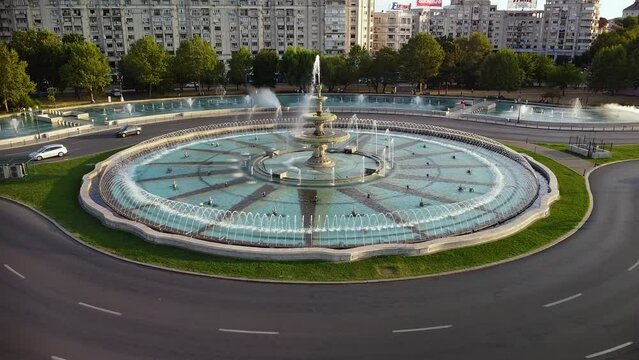 High angle drone footage of the Bucharest fountains at Piata Unirii. Union square seen from above in 4k. Beautiful summer cityscape aerial shot. 
