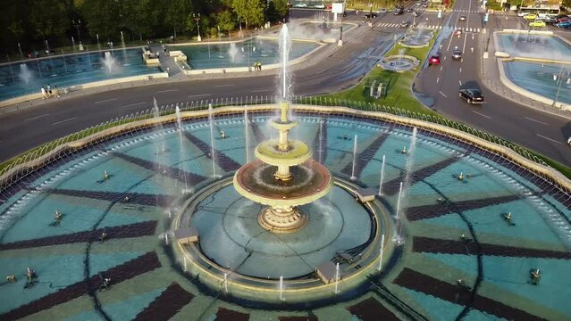 High angle drone footage of the Bucharest fountains at Piata Unirii. Union square seen from above in 4k. Beautiful summer cityscape aerial shot. 
