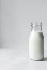 milk in a glass bottle, vegan and alternative milk in a bottle, milk for baking