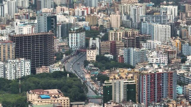 Aerial view of Dhaka city, the vibrant and bustling capital of Bangladesh. The cosmopolitan city is a blend of modern and traditional, with towering skyscrapers, bustling markets. Buriganga