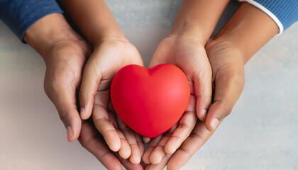 Family hands holding red heart, heart health insurance, charity volunteer donation, CSR responsibility, world heart day, world health day, family day, adoption foster care home, compliment concept