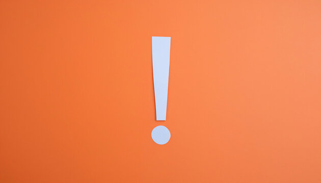 Paper cut out exclamation mark over orange background, idea, solution or communication business concept background with copy space