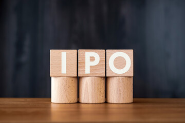 There is wood cube with the word IPO. It is an abbreviation for Initial Public Offering as eye-catching image.