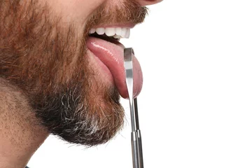 Deurstickers Man brushing his tongue with cleaner on white background, closeup © New Africa