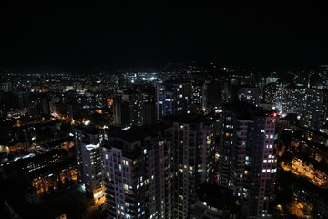 Obraz premium Picturesque view of city with buildings at night