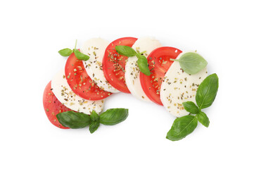 Tasty salad Caprese with mozzarella, tomatoes, basil and spices on white background, top view