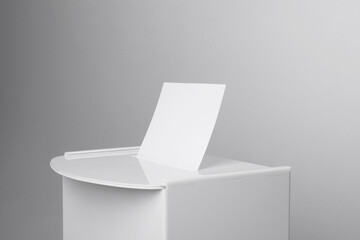 Ballot box with vote on light grey background, closeup. Election time