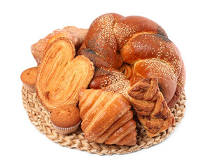 Wicker mat with different pastries isolated on white