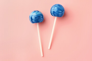 Tasty lollipops on pink background, flat lay