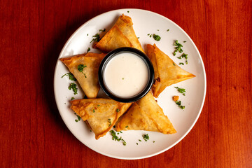 Samosas with dipping sauce