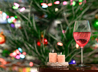 Champagne rose glass against the defocused background lights of the Christmas tree. Christmas holiday. 3d render.